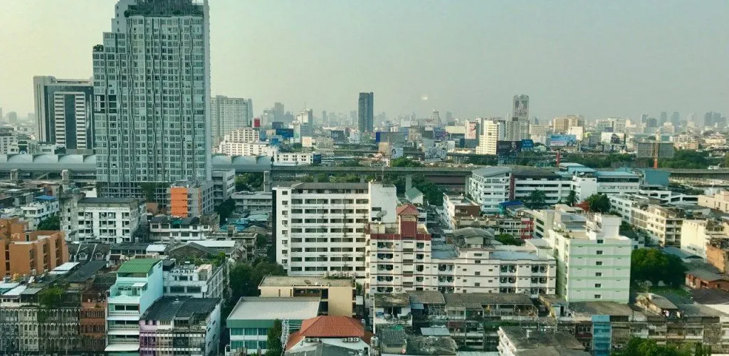 Bangkok’s high-rise skyline and sprawling cityscape under a hazy sky