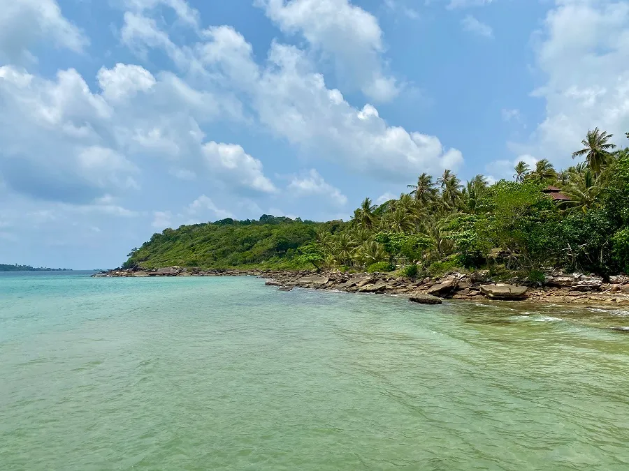 Rocky headland and clear turquoise shallows on Koh Kood