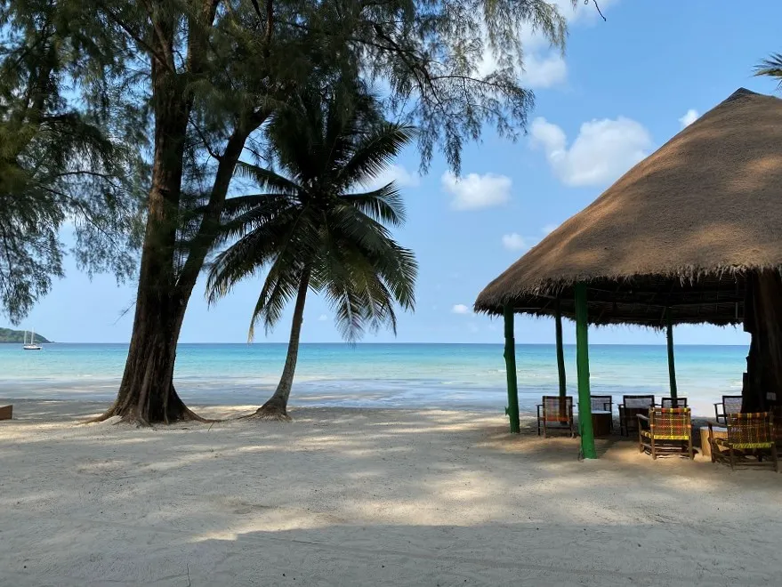 Palm trees and a thatched beach sala on Klong Chao beach, Koh Kood